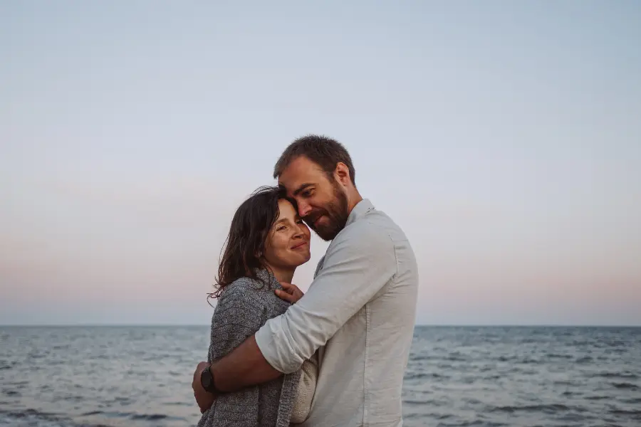 Romantic Couple standing near the sea